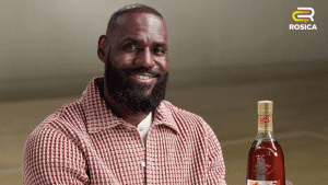 Lebron James holding a Hennessy bottle