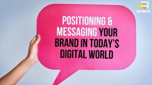 Human hand holding cardboard sign with text overlaying that says "Positioning and Messaging Your Brand in Today's Digital Space".